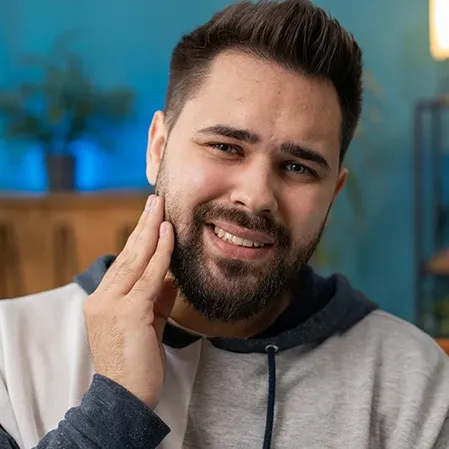 Man Holding Jaw With Tooth Pain